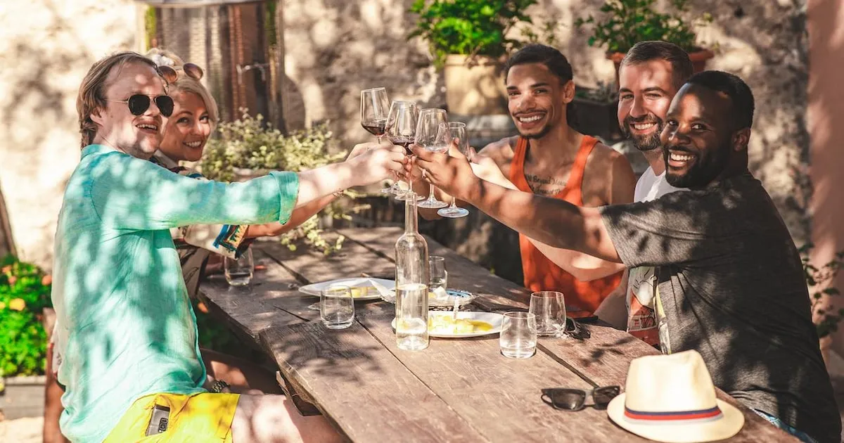 Glasses of red wine on a rustic table at a Dalmatian winery visited on the Krka waterfalls food and wine tasting day tour from Split